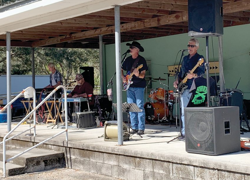 Entertainment at the festival was by the Hired Guns Band. [Photo by Katrina Elsken/Lake Okeechobee News]